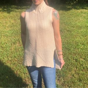 NWOT BCBGeneration loose knit sleeveless mock neck sweater.